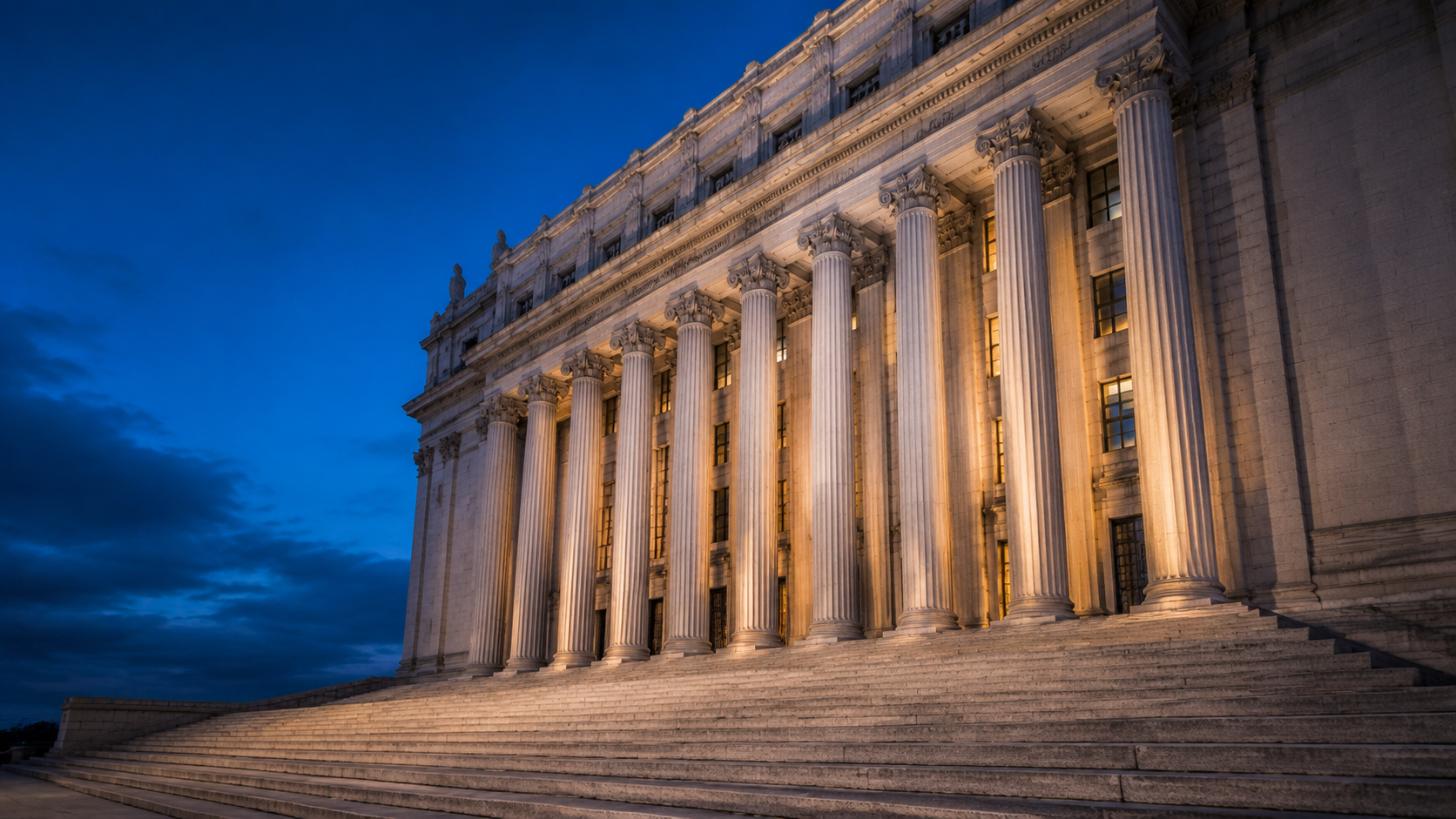 Federal courthouse columns in New York at dusk